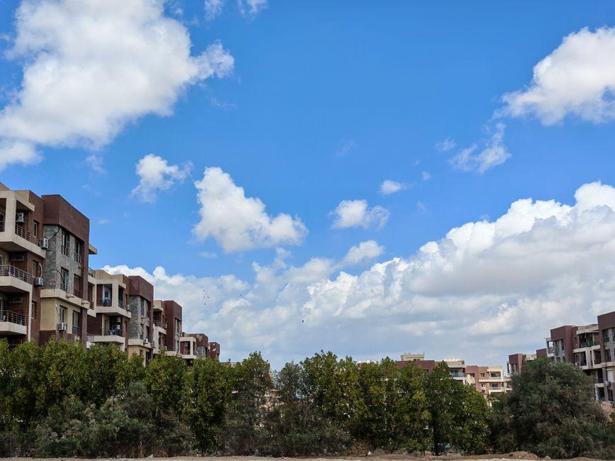 Modern Apartment Complex under Clear Blue Sky
