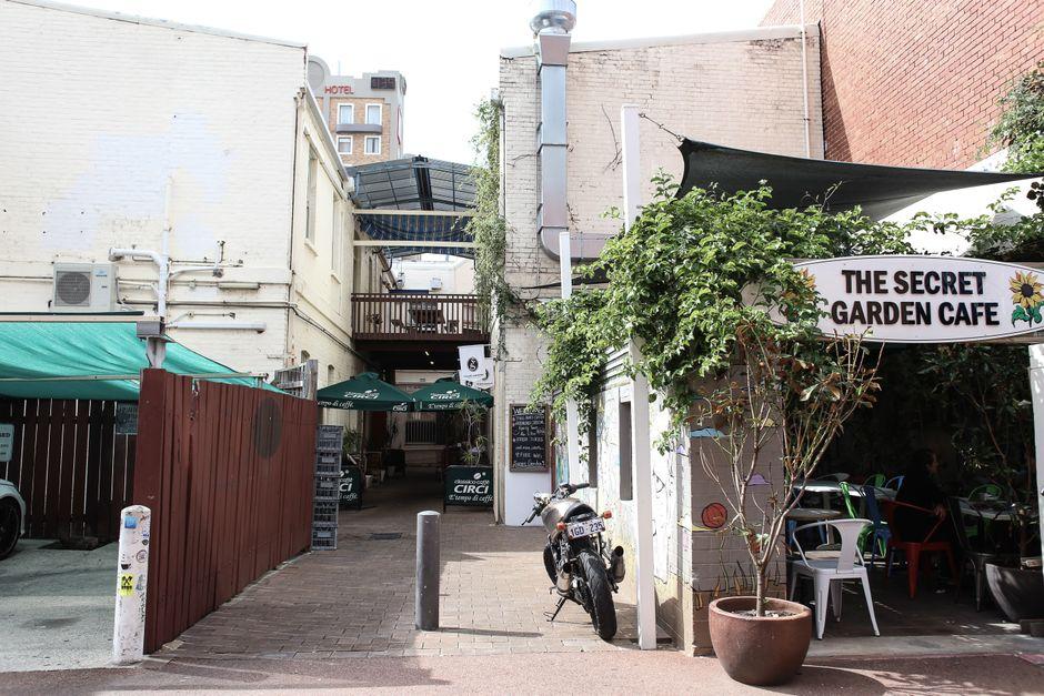 Narrow Walkway Between Shops