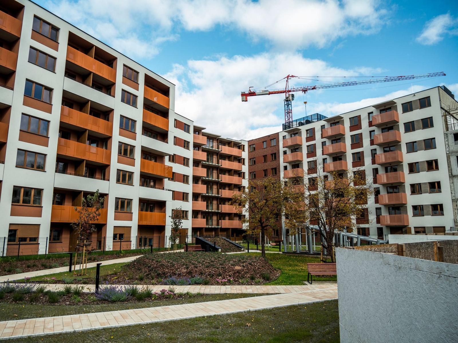 Modern Apartment Complex with Construction Crane
