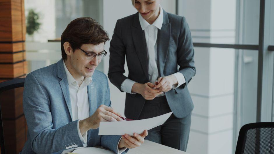 Business Colleagues Reviewing Document in Office